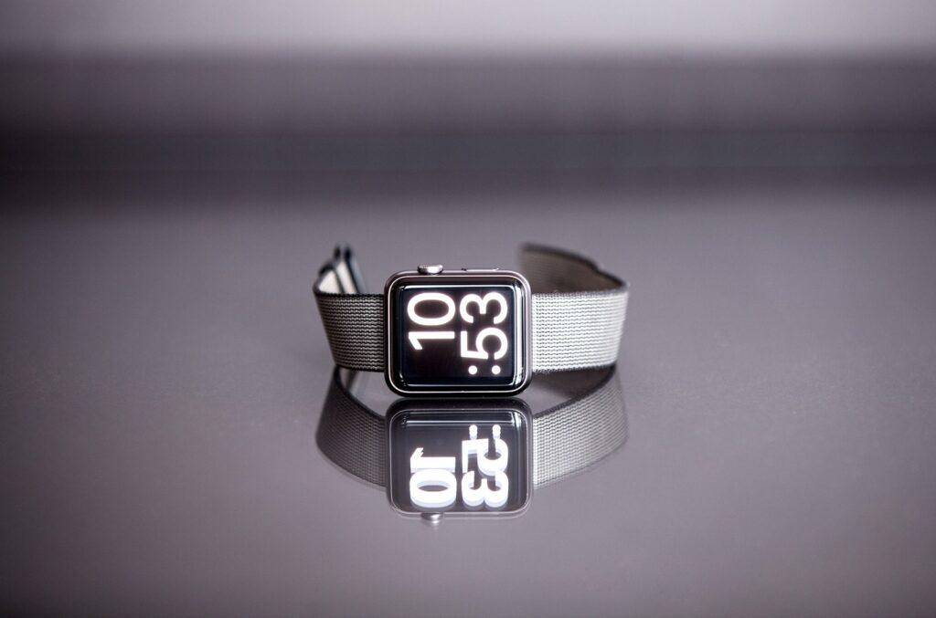 silver titanium Apple Watch with gray nylon strap - time management tips