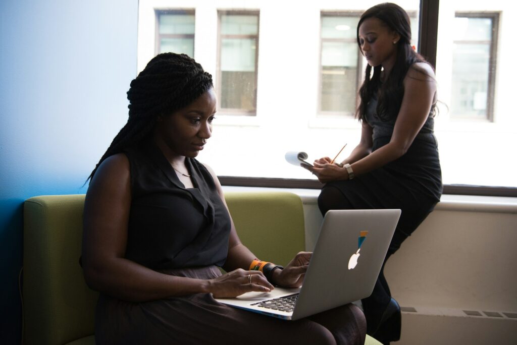 shallow focus photo of woman using MacBook - Starting A Small Business